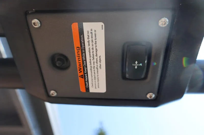 Slide: The Image of Control panel with warning label and switch on 2021 Tigé 21ZX boat. - 39