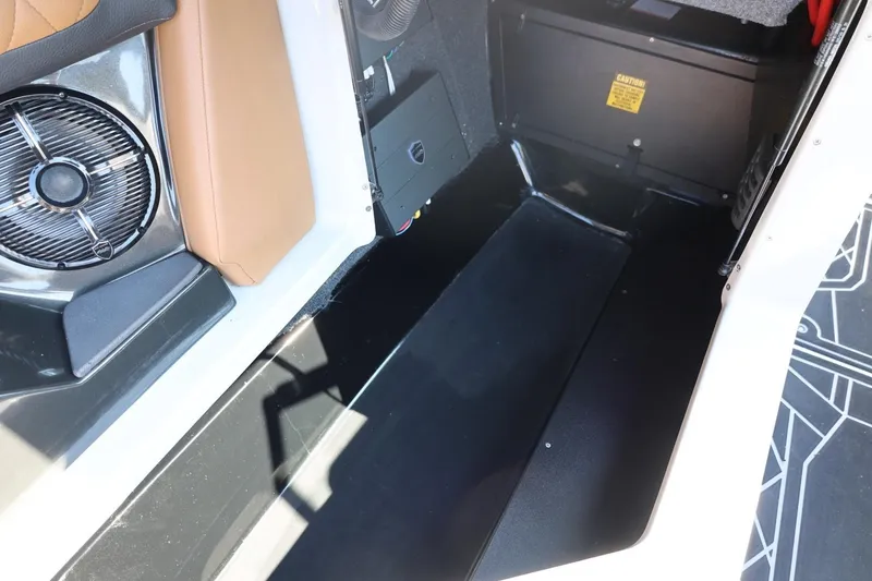 Slide: The Image of 2021 Tigé 21ZX boat interior with speaker and storage compartment. - 43