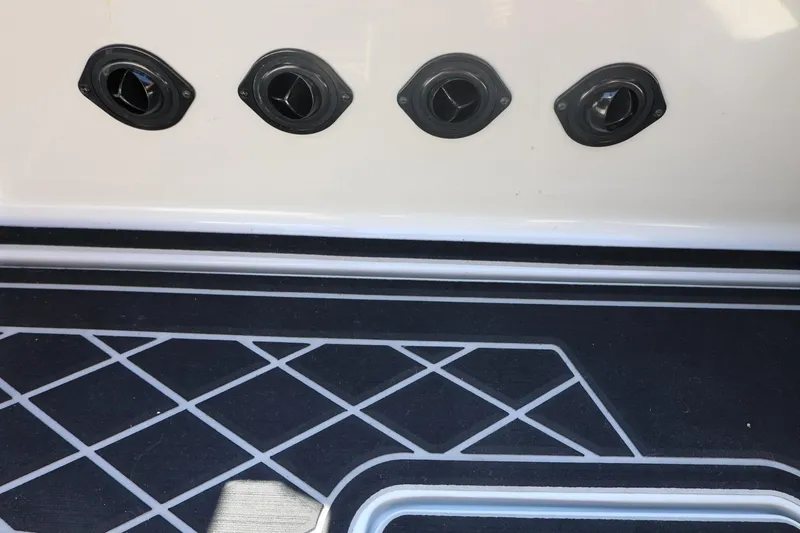 Slide: The Image of 2021 Tigé 21ZX boat deck with geometric pattern and four black vents. - 46