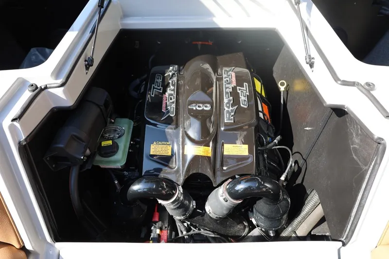 Slide: The Image of 2021 Tigé 21ZX boat engine compartment featuring a Raptor 400 motor. - 56