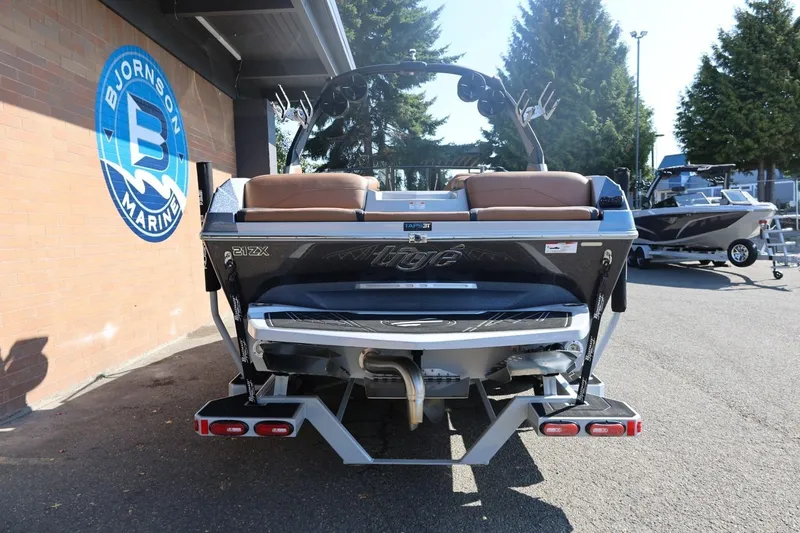 Slide: The Image of 2021 Tigé 21ZX boat at Bjornson Marine dealership, rear view. - 6
