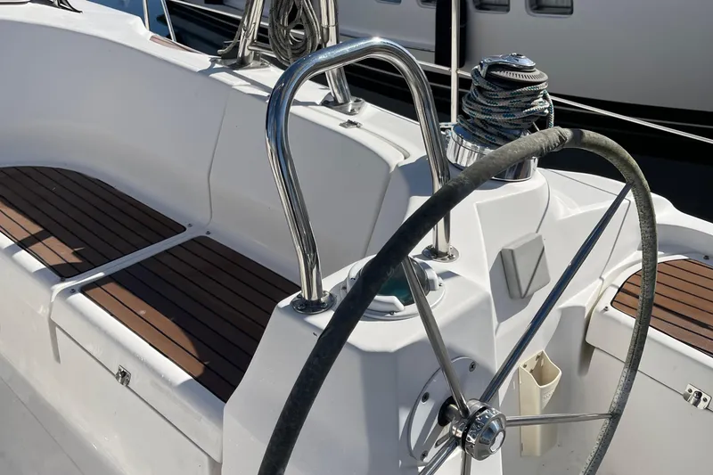 Slide: The Image of Steering wheel and seating area of a 2008 Hunter 49 sailboat. - 23