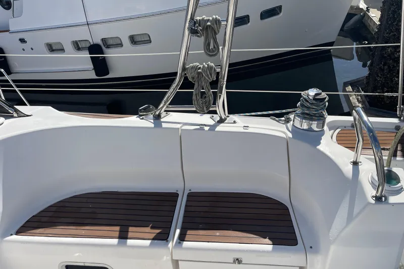 Slide: The Image of Cockpit of a 2008 Hunter 49 sailboat with wooden seating and winch. - 24
