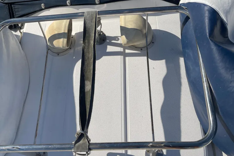 Slide: The Image of Deck of 2008 Hunter 49 sailboat with metal railing and seating. - 26