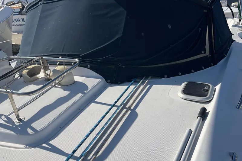 Slide: The Image of 2008 Hunter 49 sailboat deck with ropes and covered cockpit. - 27
