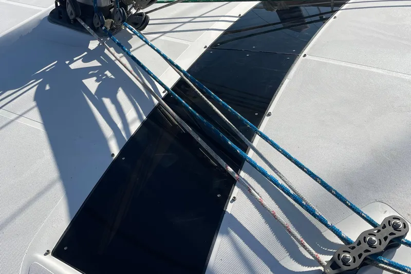 Slide: The Image of Deck of 2008 Hunter 49 sailboat with rigging and ropes in sunlight. - 28