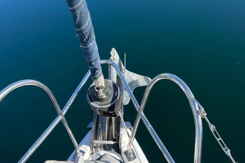 Slide: The Image of Bow of a 2008 Hunter 49 sailboat with anchor and calm water. - 30