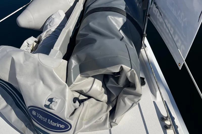 Slide: The Image of Inflatable boat on a 2008 Hunter 49 sailboat deck, featuring West Marine branding. - 31