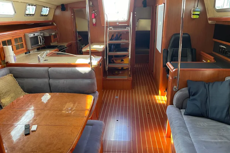 Slide: The Image of Luxurious interior of a 2008 Hunter 49 yacht with wood finishes and modern amenities. - 4