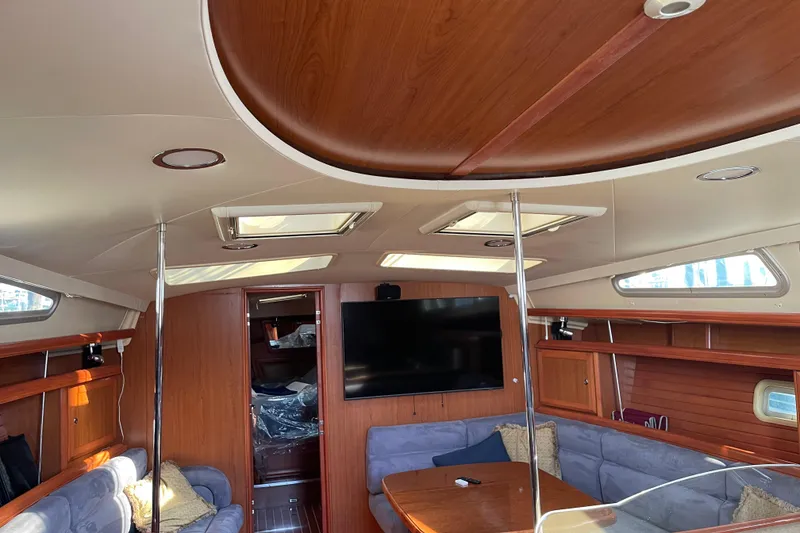 Slide: The Image of Interior of 2008 Hunter 49 yacht with wood finish and cozy seating area. - 50
