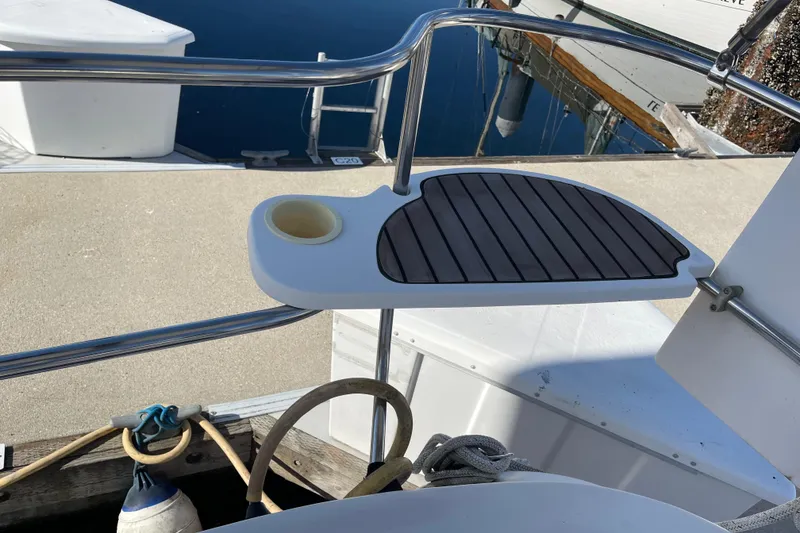 Slide: The Image of Hunter 49 yacht deck detail with cup holder, 2008 model, docked at marina. - 65