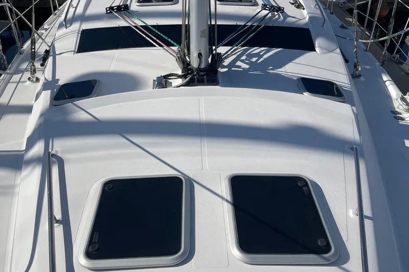Slide: The Image of Deck view of a 2008 Hunter 49 sailboat, showcasing hatches and rigging. - 67