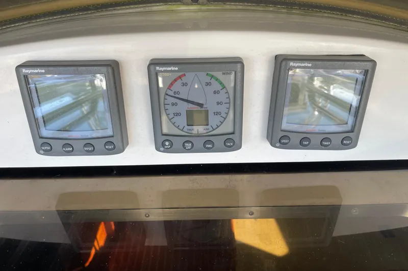 Slide: The Image of Raymarine instruments on 2008 Hunter 49 yacht dashboard, displaying navigation data. - 69