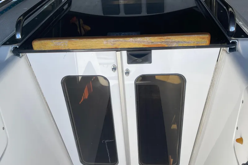 Slide: The Image of Cabin entrance of a 2008 Hunter 49 sailboat with wooden trim and glass doors. - 70