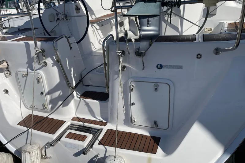 Slide: The Image of 2008 Hunter 49 yacht cockpit with steering wheel and deck details. - 8