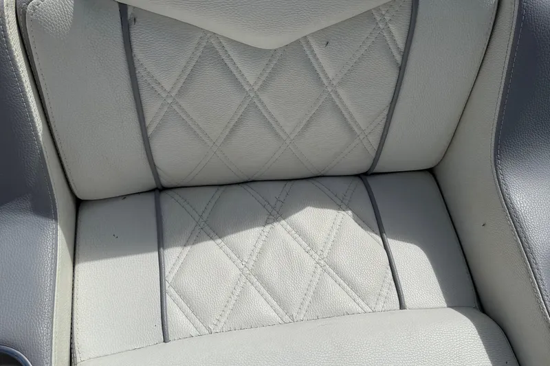 Slide: The Image of Quilted white leather seat of 2005 Marlago 35 boat, showcasing elegant design. - 31
