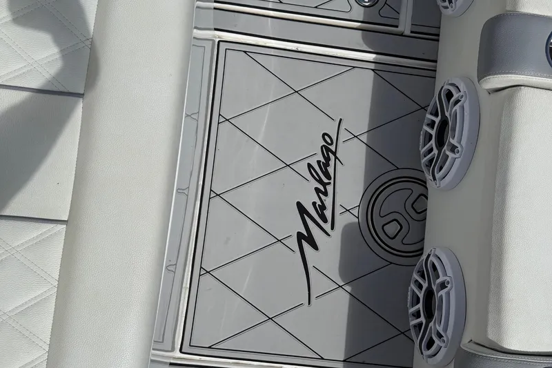 Slide: The Image of 2005 Marlago 35 boat interior with logo and speaker details. - 32