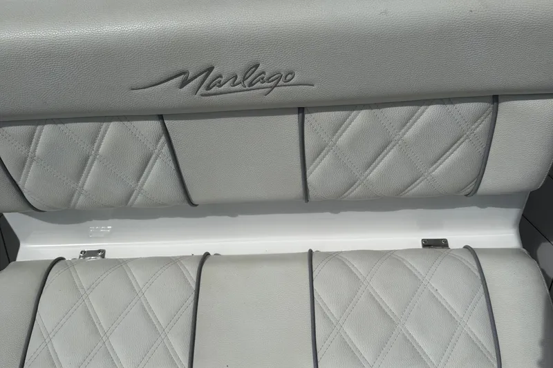 Slide: The Image of Quilted leather seating in a 2005 Marlago 35 boat, featuring elegant stitching. - 33