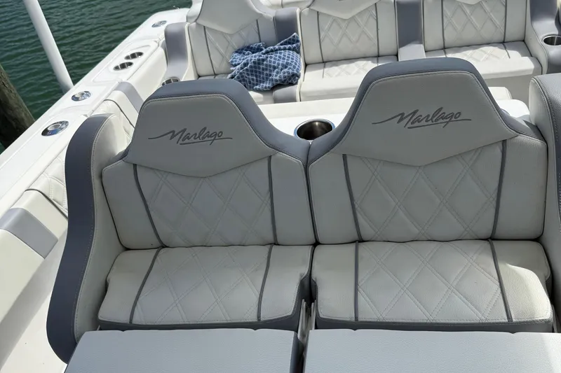 Slide: The Image of Luxury seating on a 2005 Marlago 35 boat with diamond-stitched upholstery. - 36