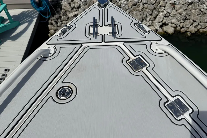 Slide: The Image of Bow of a 2005 Marlago 35 boat with sleek design and hardware details. - 42