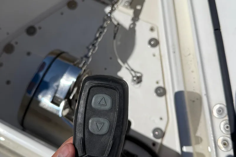 Slide: The Image of Remote control for anchor winch on 2005 Marlago 35 boat, with chain and winch visible. - 48