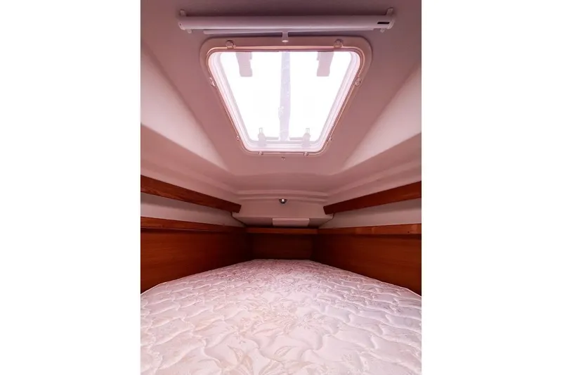 Slide: The Image of Master cabin interior with overhead hatch and comfortable bedding. - 17