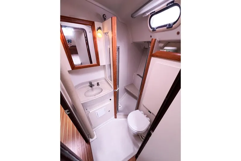 Slide: The Image of Head area with with sink, toilet, mirror and shower - 18