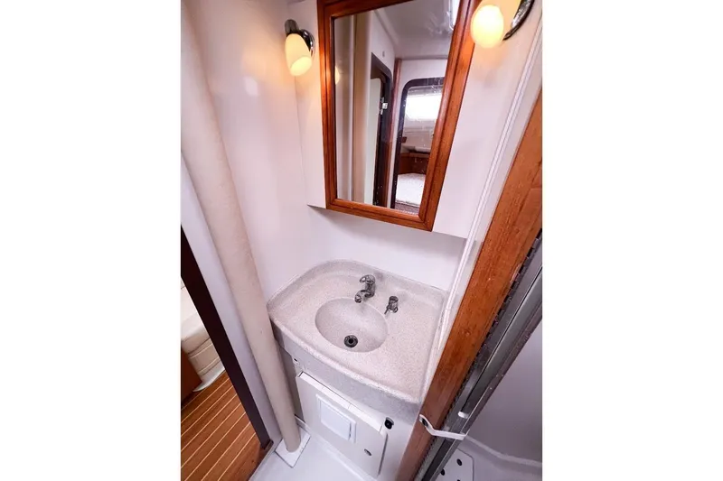 Slide: The Image of Bathroom sink featuring mirror and lighting - 20