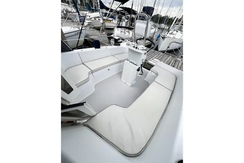 Slide: The Image of Large cockpit with cushions. Easy access to aft platform around folded Lewmar wheel - 24