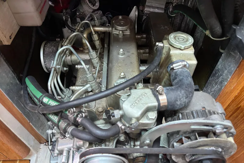 Slide: The Image of Engine compartment of a 2007 Catalina 350 MkII sailboat, showing detailed mechanical components. - 34