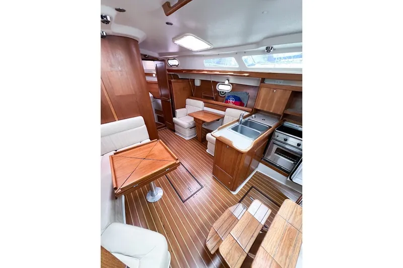 Slide: The Image of Salon looking forward at starboard lounge chairs and galley - 9