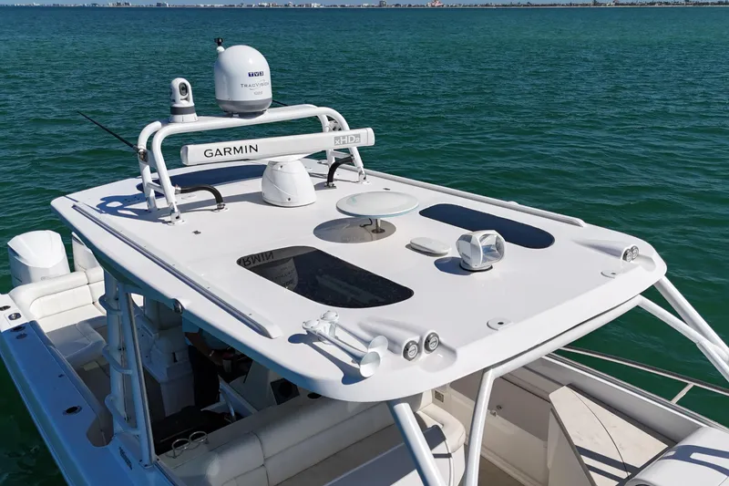 Slide: The Image of 2017 Everglades 360LXC boat with advanced Garmin navigation system on open water. - 12