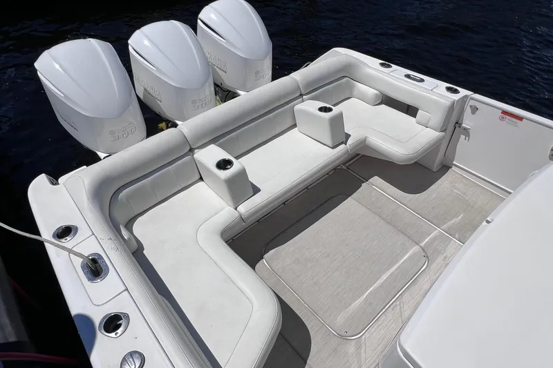 Slide: The Image of 2017 Everglades 360LXC boat with spacious seating and triple Yamaha engines. - 21