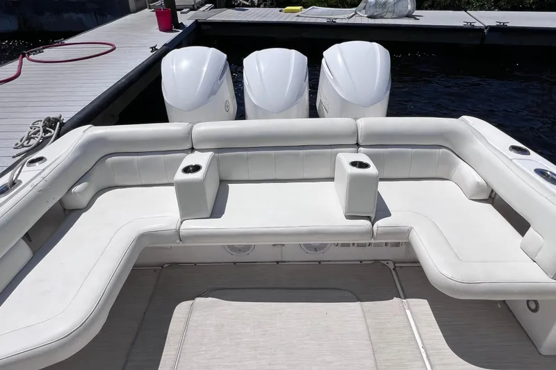 Slide: The Image of 2017 Everglades 360LXC boat with spacious seating and triple outboard engines. - 23