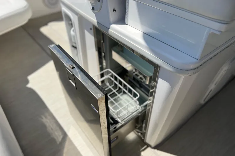Slide: The Image of Open drawer on 2017 Everglades 360LXC boat, showcasing storage compartment. - 28
