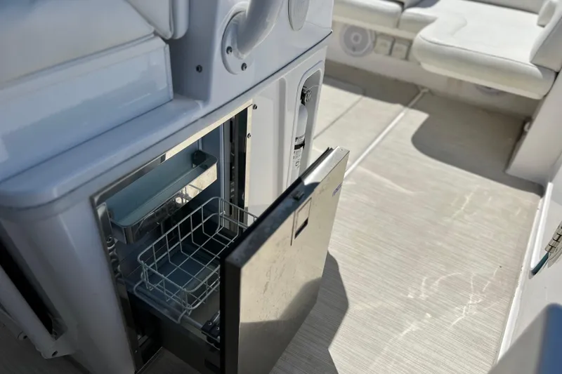 Slide: The Image of Open drawer on 2017 Everglades 360LXC boat, showcasing interior storage space. - 29