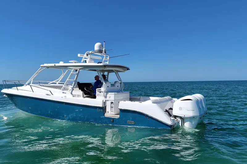 Slide: The Image of 2017 Everglades 360LXC boat cruising on clear blue ocean waters. - 3