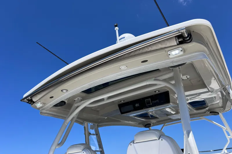 Slide: The Image of 2017 Everglades 360LXC boat roof detail against clear blue sky. - 37