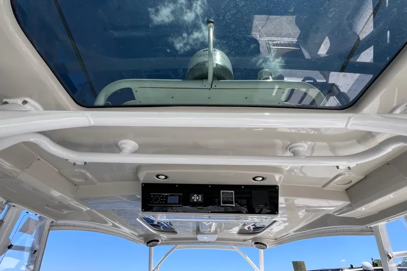 Slide: The Image of 2017 Everglades 360LXC boat interior with glass roof and control panel. - 42