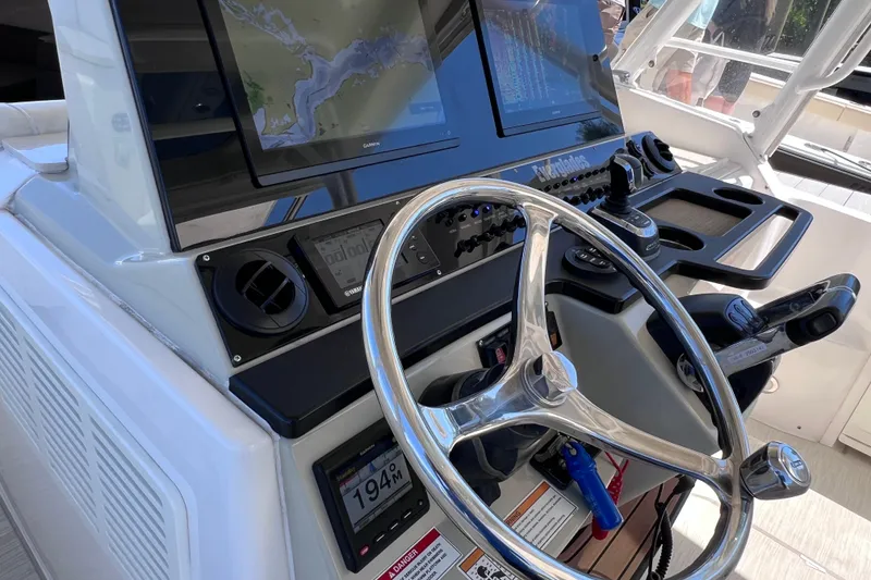 Slide: The Image of Helm of 2017 Everglades 360LXC boat with advanced navigation displays and controls. - 47