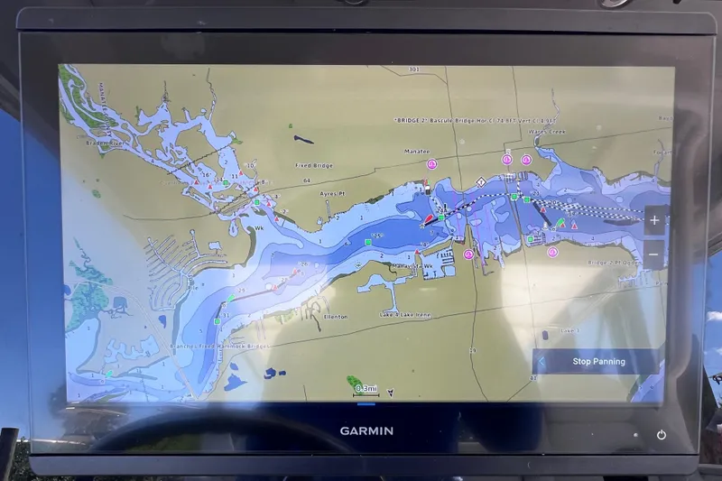 Slide: The Image of Garmin marine navigation display on 2017 Everglades 360LXC boat, showing detailed waterway map. - 49
