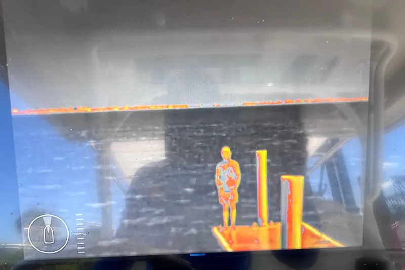 Slide: The Image of Thermal imaging display on Everglades 360LXC boat, showing a person and surroundings. - 50