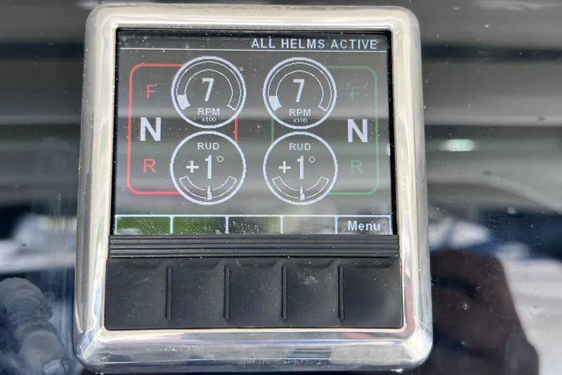 Slide: The Image of Control panel of a 2017 Everglades 360LXC boat displaying RPM and rudder settings. - 54