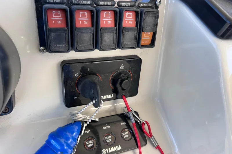Slide: The Image of Control panel of a 2017 Everglades 360LXC boat with Yamaha engine switches. - 57