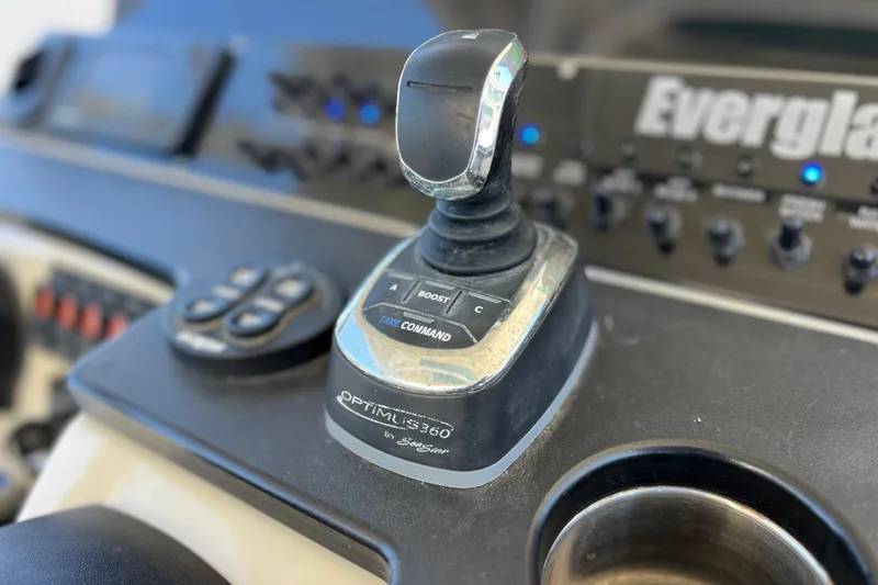 Slide: The Image of Control panel of 2017 Everglades 360LXC boat featuring joystick and buttons. - 58
