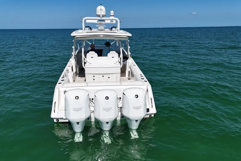 Slide: The Image of 2017 Everglades 360LXC boat with triple engines on open water. - 6