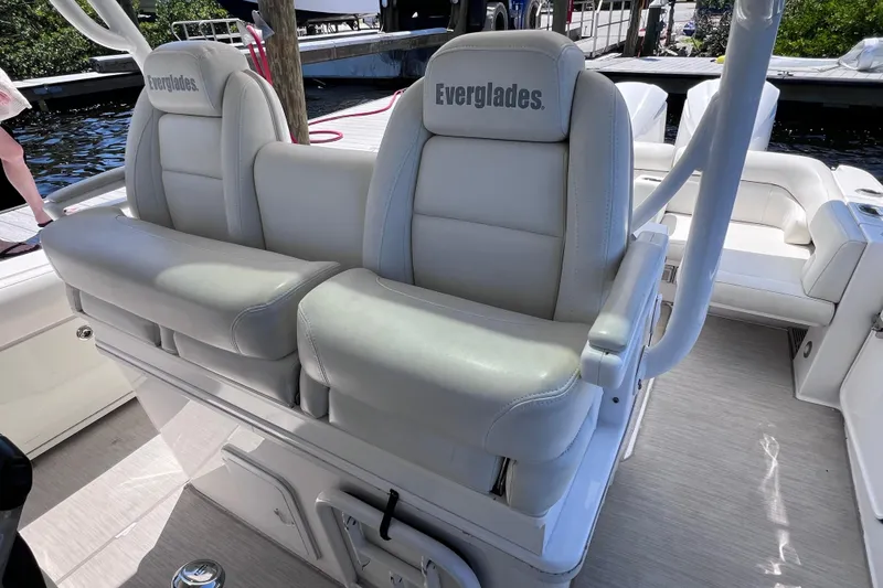 Slide: The Image of 2017 Everglades 360LXC boat interior with white cushioned seats and branded headrests. - 63