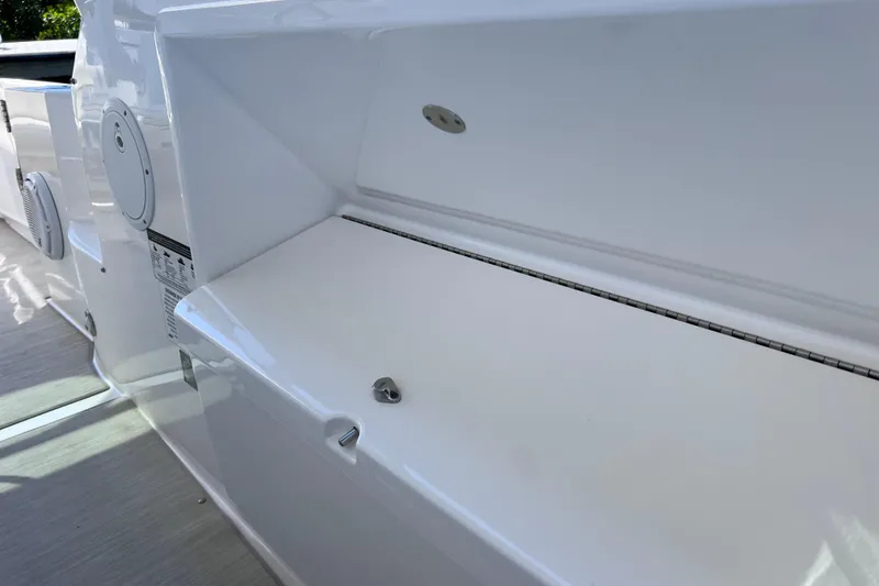 Slide: The Image of 2017 Everglades 360LXC boat interior detail, featuring sleek white surfaces and modern design elements. - 65