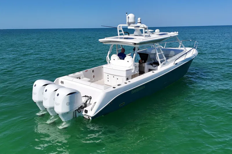 Slide: The Image of 2017 Everglades 360LXC boat cruising on clear blue ocean waters. - 7