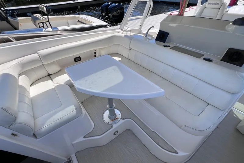Slide: The Image of Luxurious seating area on a 2017 Everglades 360LXC boat with a sleek table. - 70